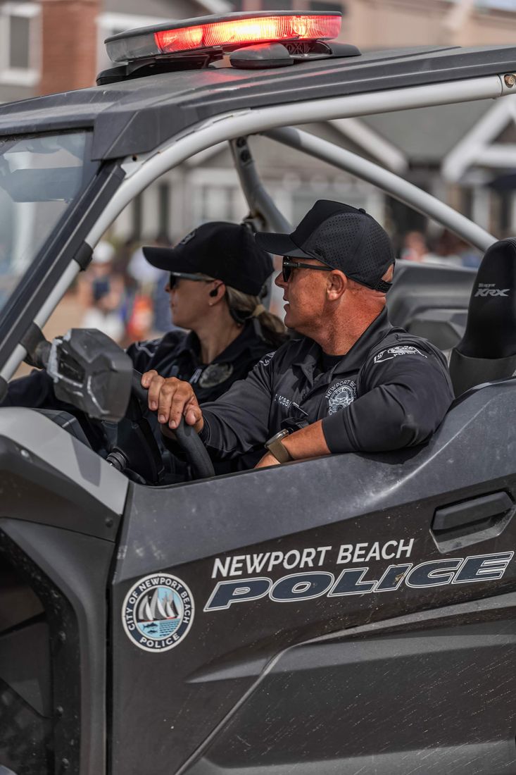 NBPD officers patrolling in a Newport Beach Police UTV